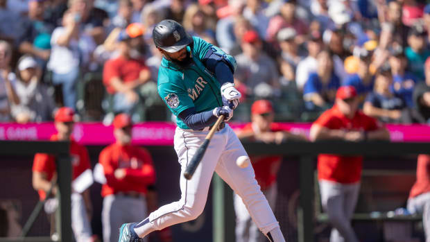 Sep 13, 2023; Seattle, Washington, USA; Seattle Mariners right fielder Teoscar Hernandez (35) hits a RBI-single during the fifth inning against the Los Angeles Angels at T-Mobile Park. Mandatory Credit: Stephen Brashear-USA TODAY Sports